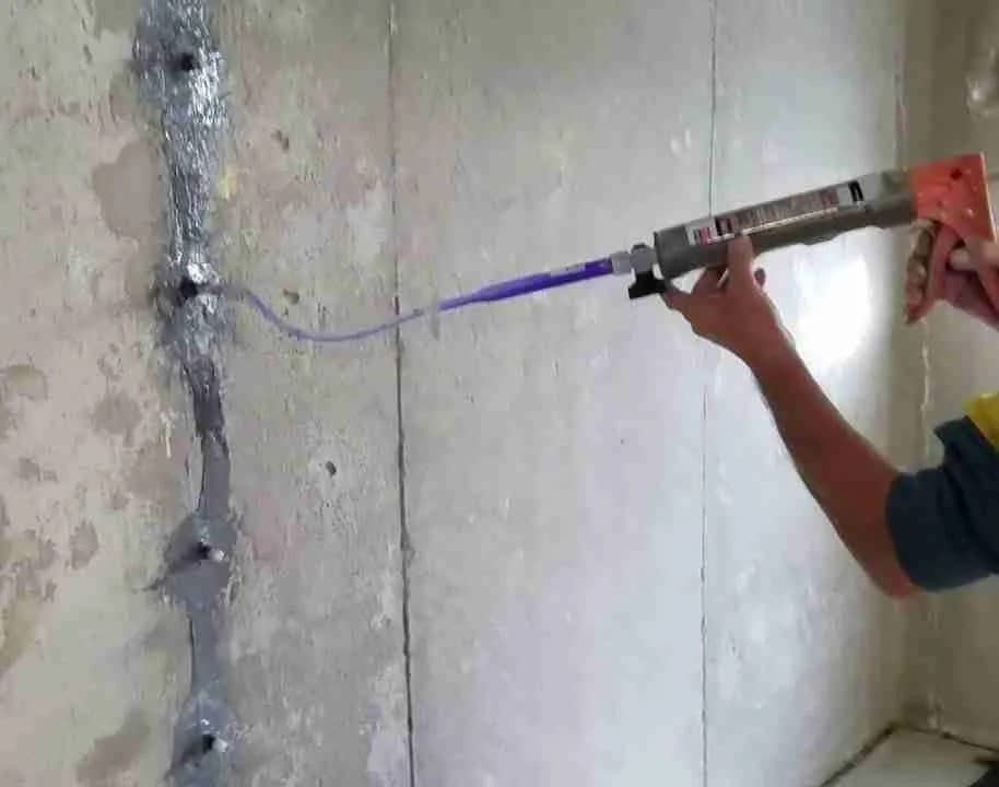 Sealing a crack in a poured concrete foundation wall from the inside